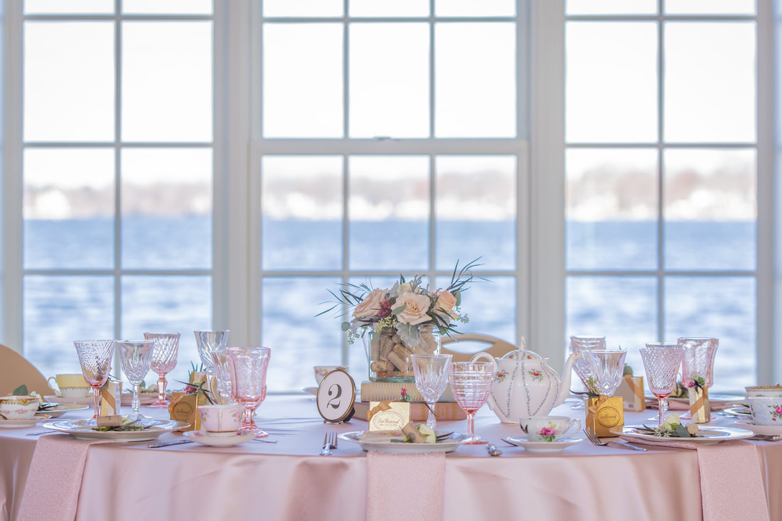 Pink glassware, teacups and saucers, and white lace dinner plate at Main Beach Pavilion in Crystal Lake, IL