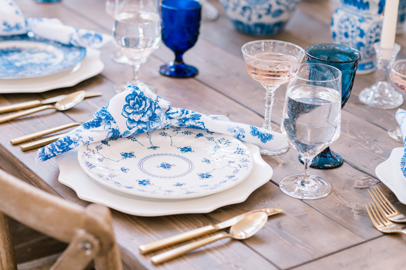 Blue and white dinnerware rental and blue glassware rentals on a farm table at Providence Vineyard in Hebron IL.