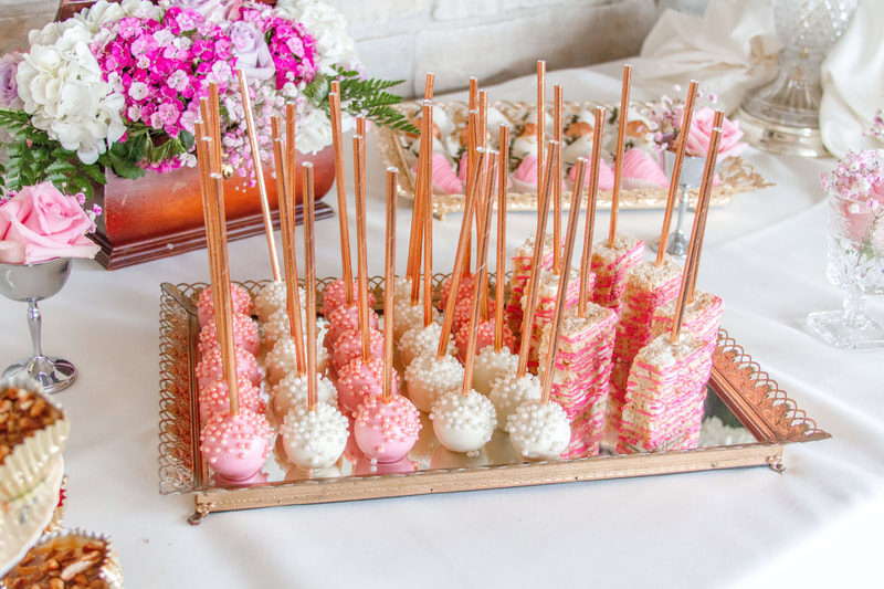 Cake pops on a gold mirror tray in Rockford Illinois