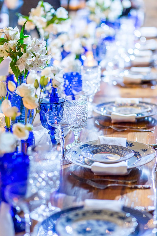 Cobalt blue glassware rentals mixed with blue & white dishes at the Brix in Carpentersville IL