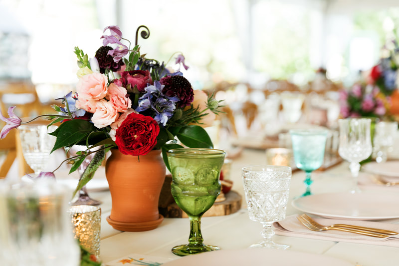 Green teal and clear wedding rentals on a table in Winnetka IL 