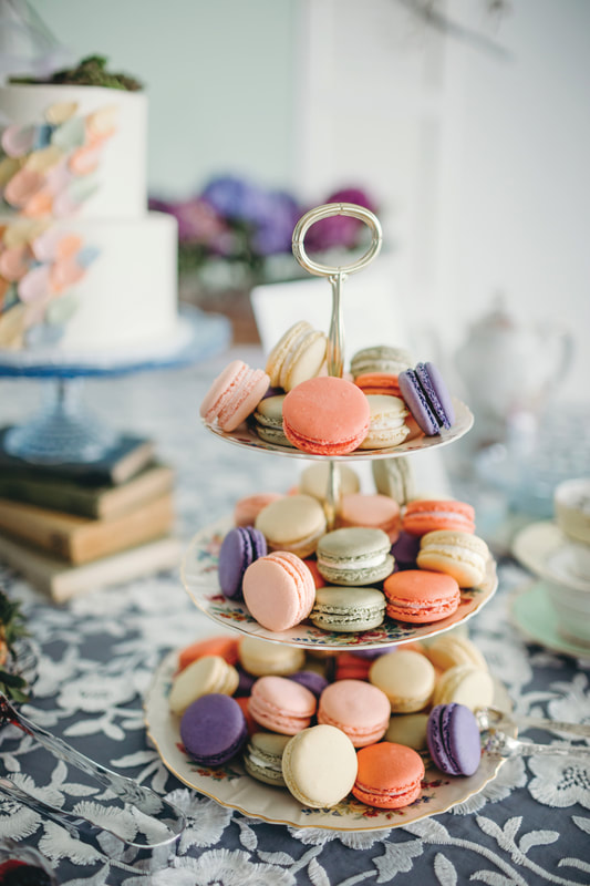 blue cake stand, stack of books with three-tiered dessert tray