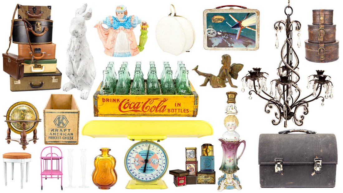 Suitcases, tea pot, suitcases, lunch box, tea tins, bottles rabbit, figurines, chandelier, crates, box, globe, cart, ottoman, scale candleholder