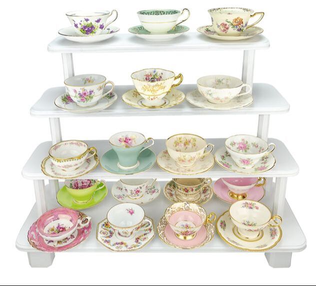 White wooden stand with Elegant Floral teacups and saucers