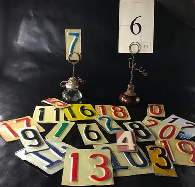 Door Knob table number holders with cut out license plate numbers