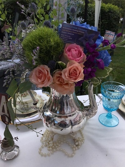 Silver teapot rentals with bold flowers for a bridal shower in Woodstock il