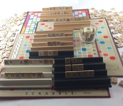 Vintage Scrabble tiles on rails sitting on the game board Party Rental near Rockford Illinois