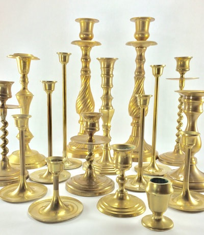 Brass candleholders. Brass candlesticks. Various sizes and heights.