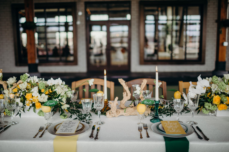 Chicago style weddings tablescape winner photo of a green and yellow table with Lemons.
