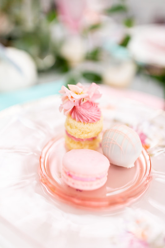 pink desserts on a pink glass plate bridal shower tea
