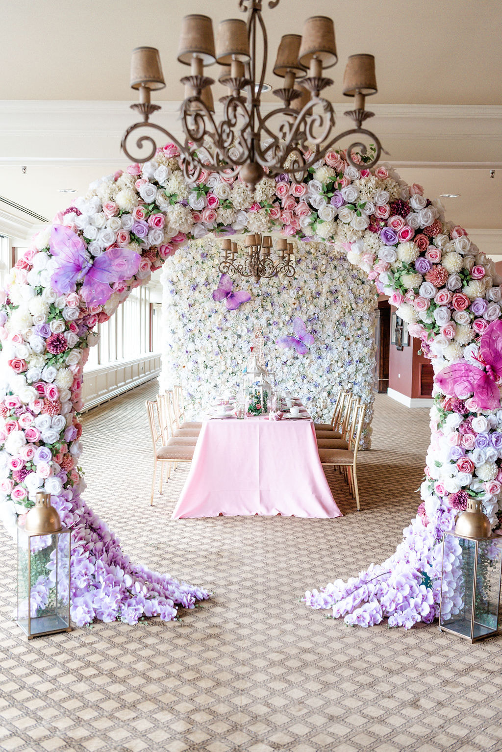 Flora arch and pink high tea table settings