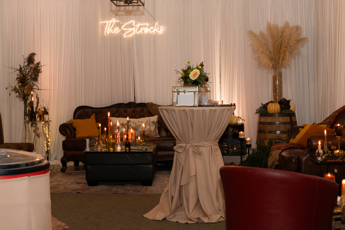 Lounge area created in a garage.  Candlelight and some of our decor rentals. 