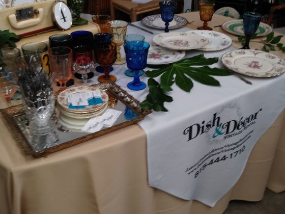 Table with colorful glasses and plates