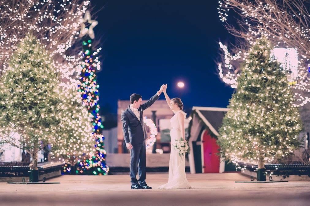 Wedding Couple outside by Christmas trees