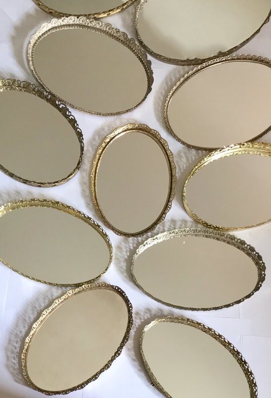 Vintage Gold Oval Mirror Trays to use for centerpieces. Party Rental Near Naperville Illinois.