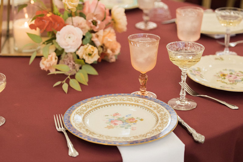 Bold and Beautiful dinnerware, blush goblet, etched champagne coupe, linens