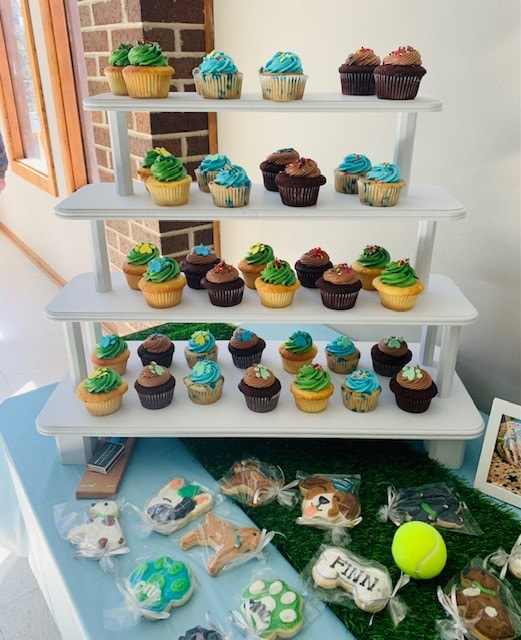 Our four-tiered wooden white stand displaying cupcakes for a One-Year-Old's birthday 