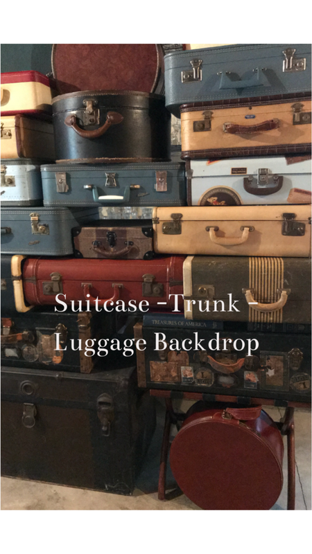 A stack or vintage suitcases used as a photo back drop 